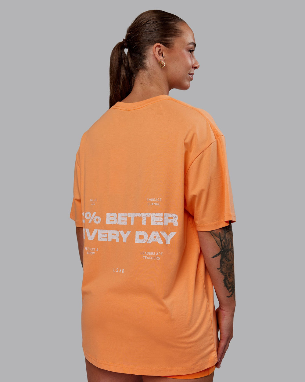 Woman wearing Unisex 1% Better Value Series FLXCotton Tee Oversize - Sorbet-Festival Bloom