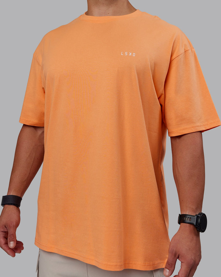 Man wearing Unisex 1% Better Value Series FLXCotton Tee Oversize - Sorbet-Festival Bloom
