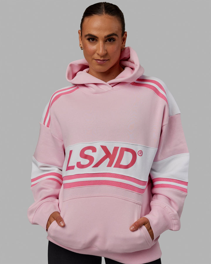 Woman wearing Unisex A-Team Hoodie Oversize - Petal Pink-White