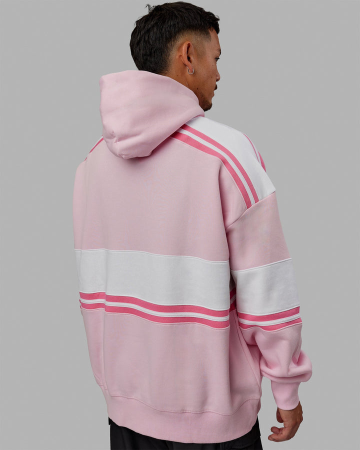 Man wearing Unisex A-Team Hoodie Oversize - Petal Pink-White