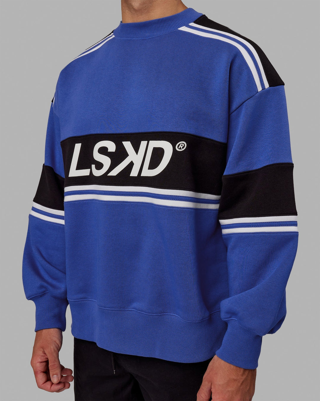 Man wearing Unisex A-Team Sweater Oversize - Power Cobalt-Black