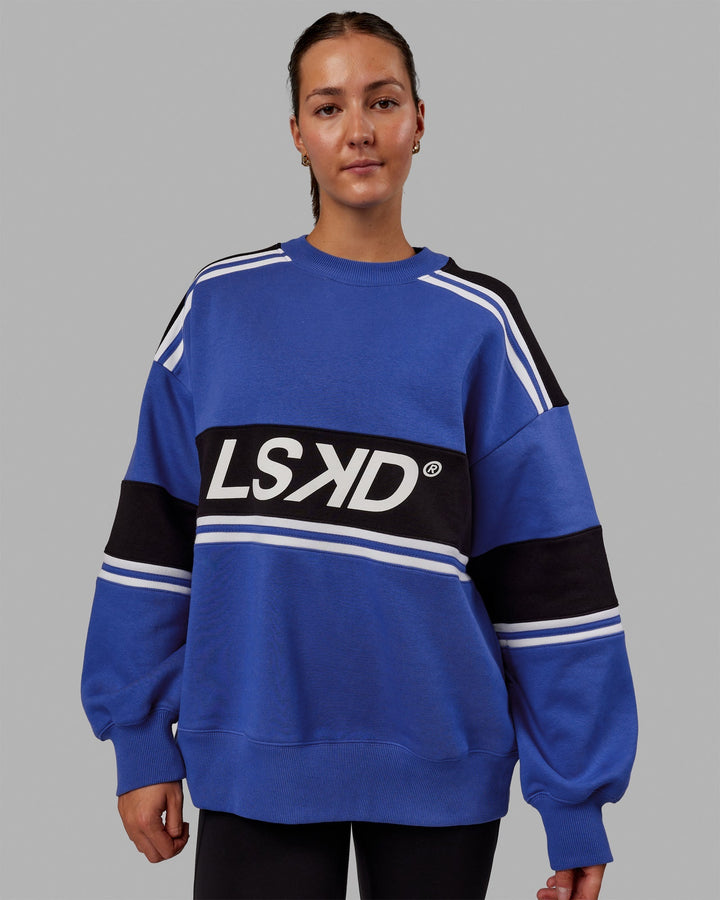 Woman wearing Unisex A-Team Sweater Oversize - Power Cobalt-Black
