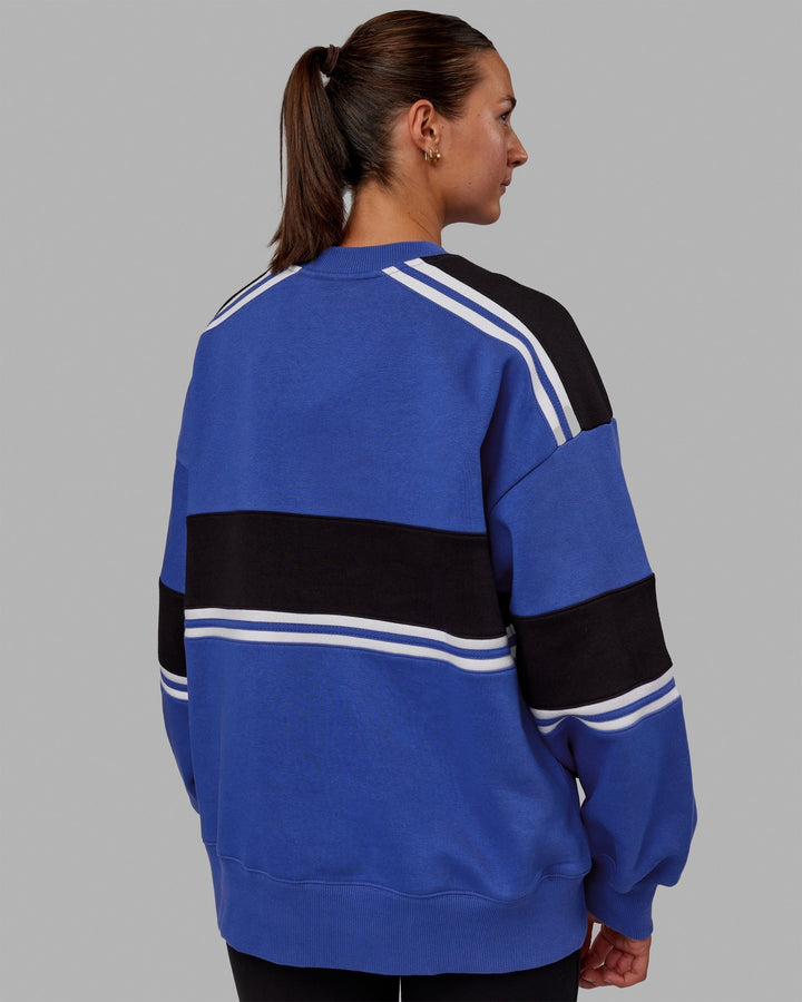 Woman wearing Unisex A-Team Sweater Oversize - Power Cobalt-Black
