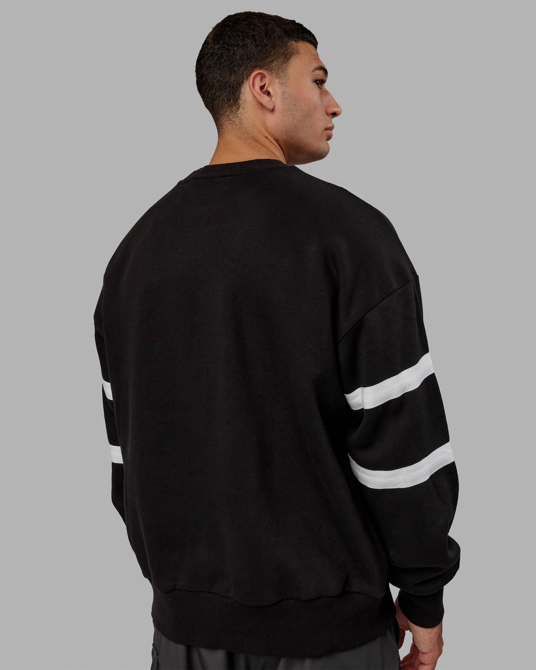 Man wearing Unisex Collateral Sweater Oversize - Black-White