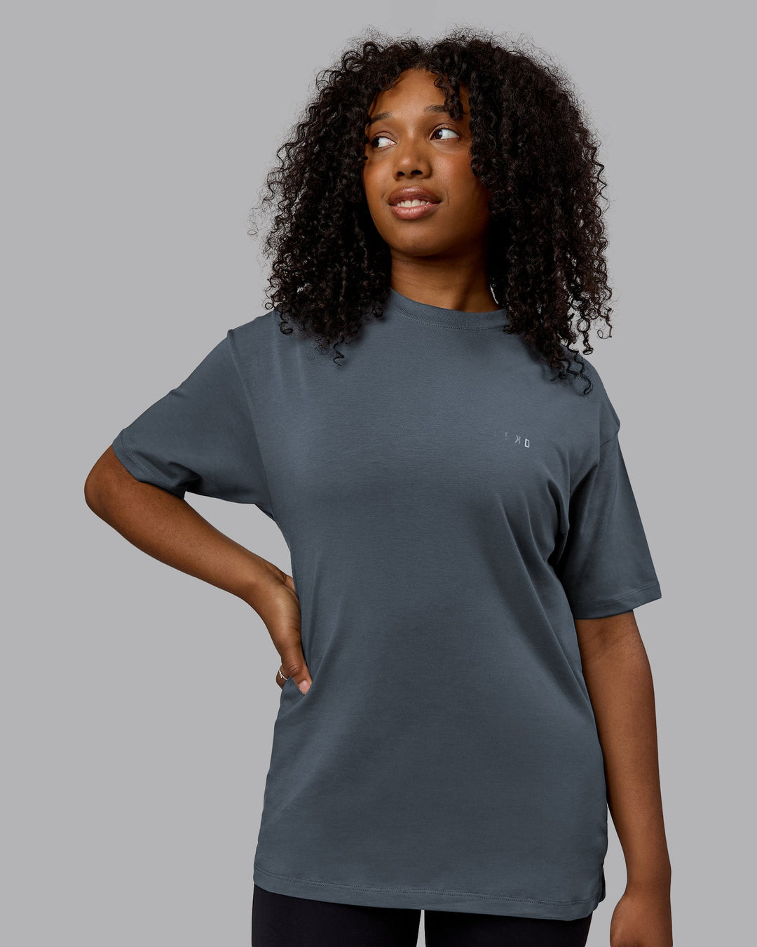 Woman wearing Unisex Deluxe PimaFLX Tee Oversize - Turbulence