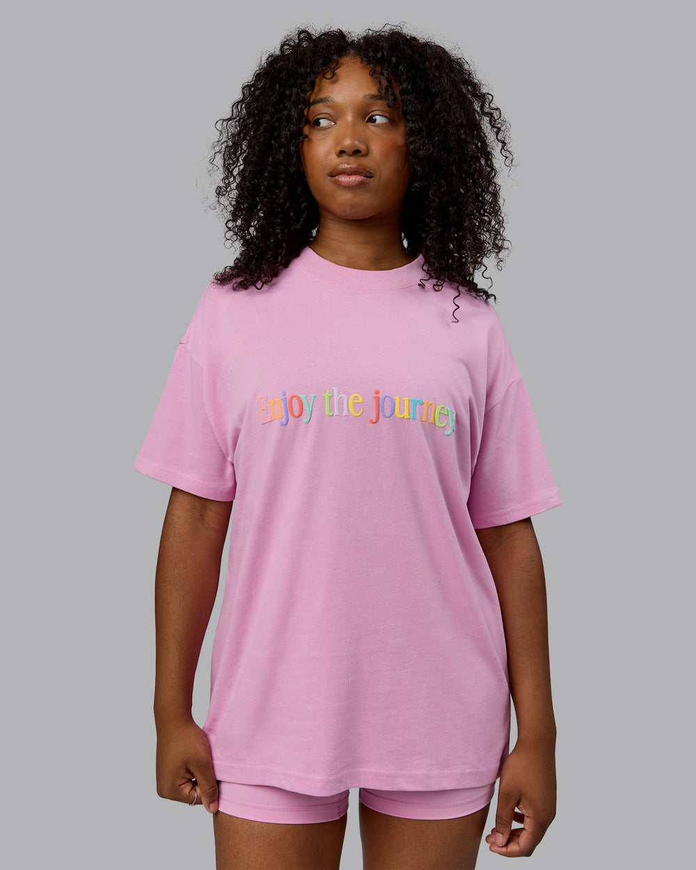 Woman wearing Unisex Enjoy The Journey Heavyweight Tee Oversize - Bubblegum-Multi