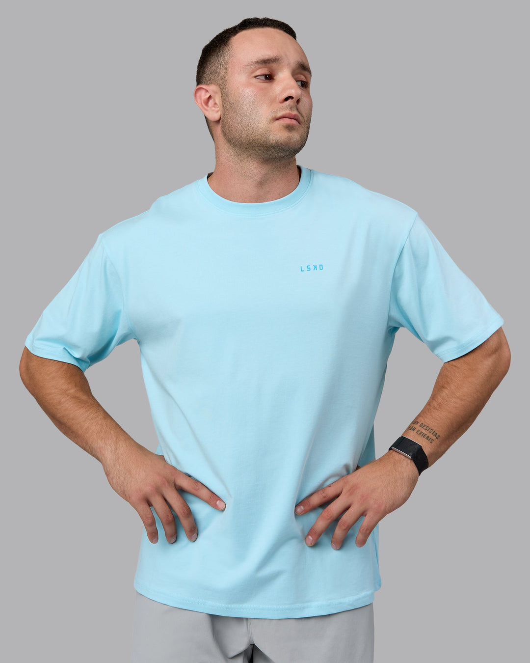 Man wearing Unisex Enjoy the Journey Value Series FLXCotton Tee Oversize - Crystal Blue-Bay Blue