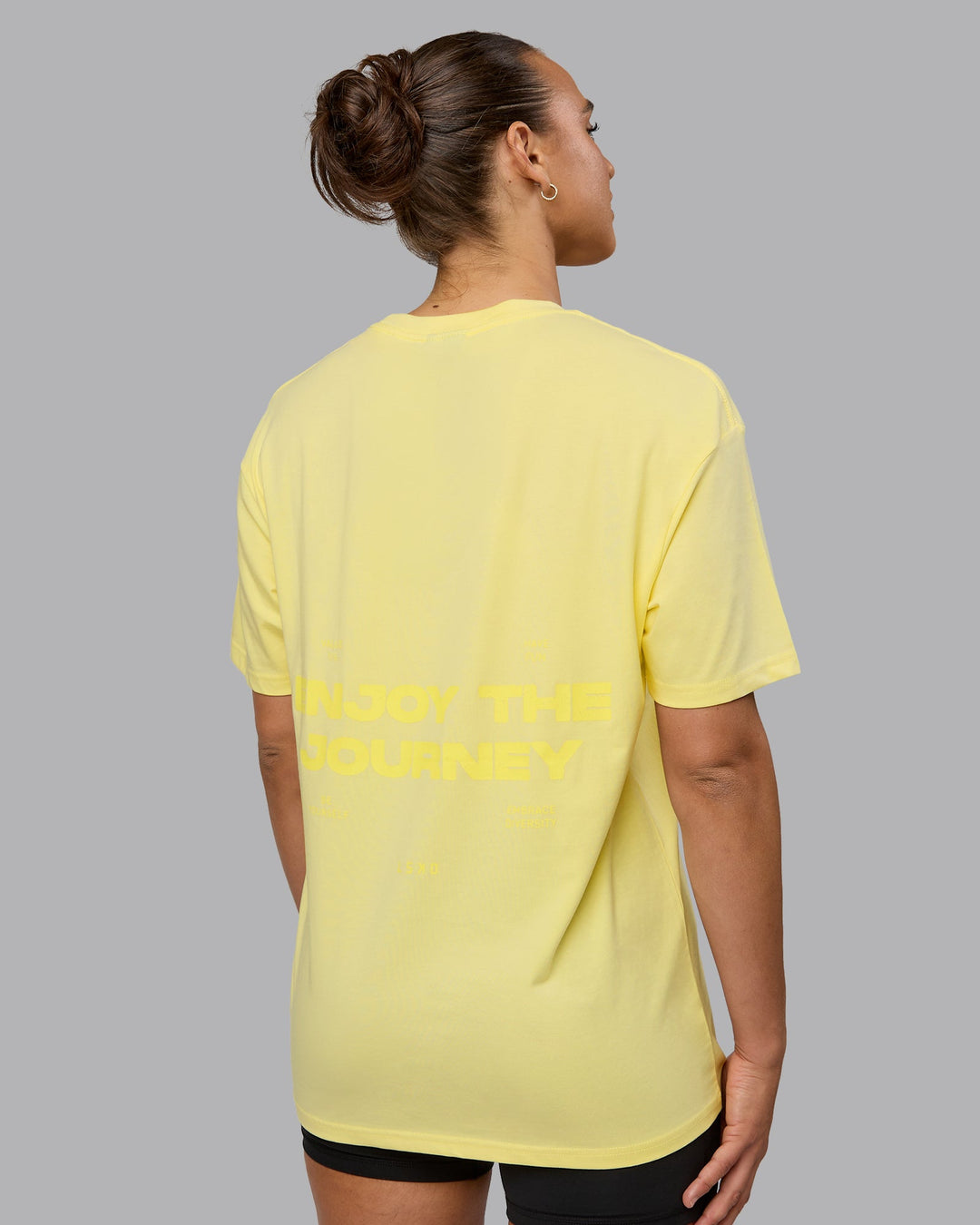 Woman wearing Unisex Enjoy the Journey Value Series FLXCotton Tee Oversize - Pale Yellow-Sundress