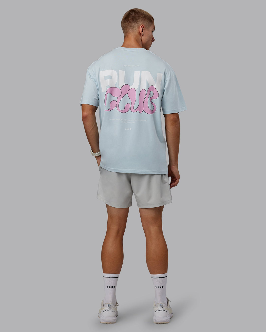 Man wearing Unisex Gone Running FLXCotton Tee Oversize - Skyride-Bubblegum