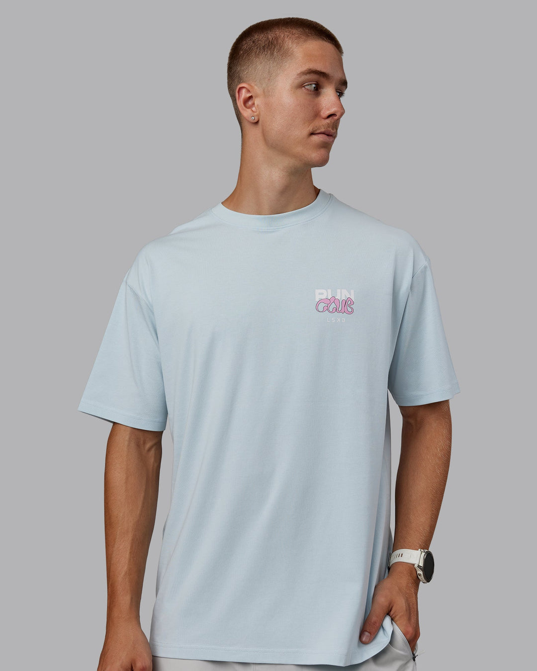 Man wearing Unisex Gone Running FLXCotton Tee Oversize - Skyride-Bubblegum