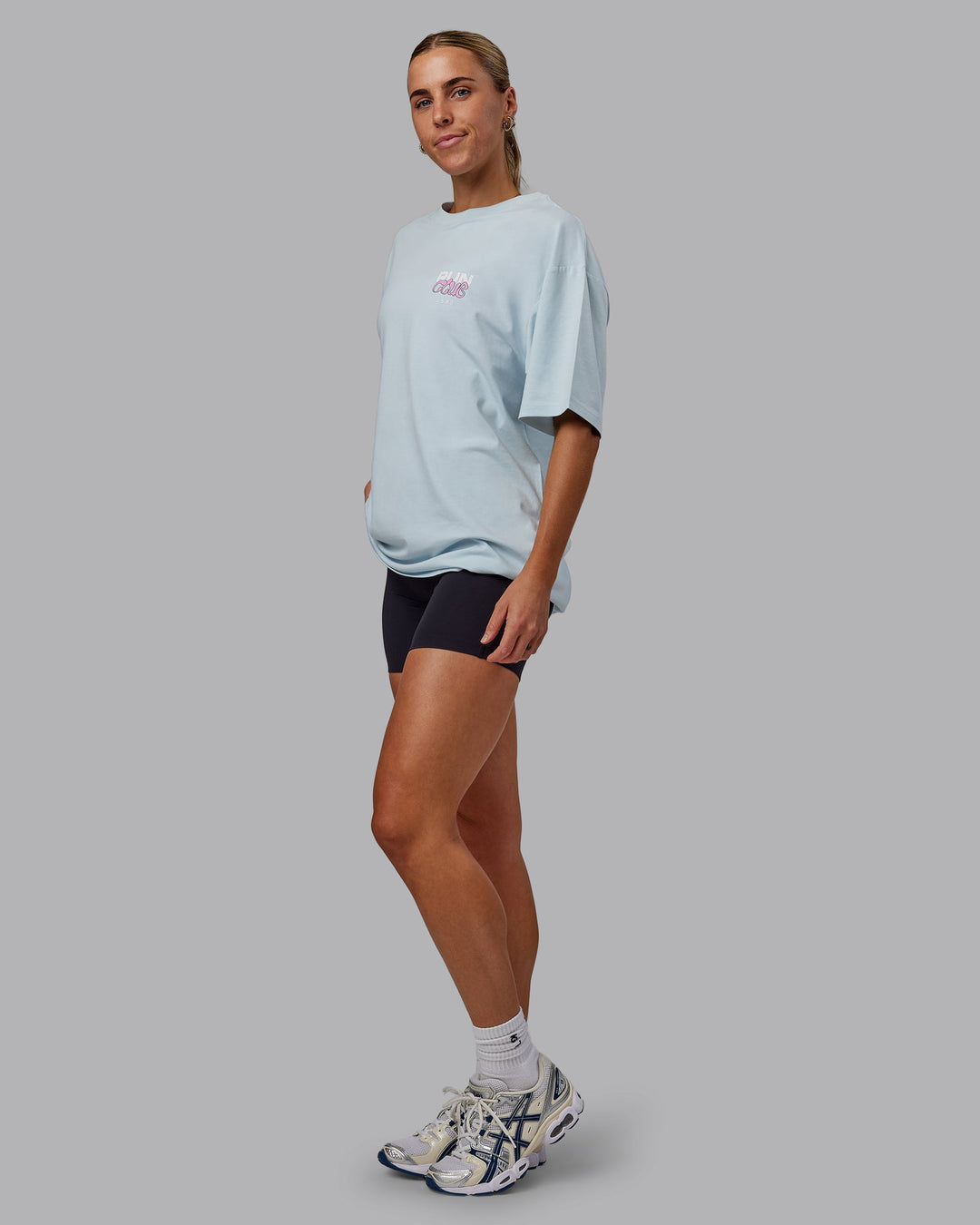 Woman wearing Unisex Gone Running FLXCotton Tee Oversize - Skyride-Bubblegum