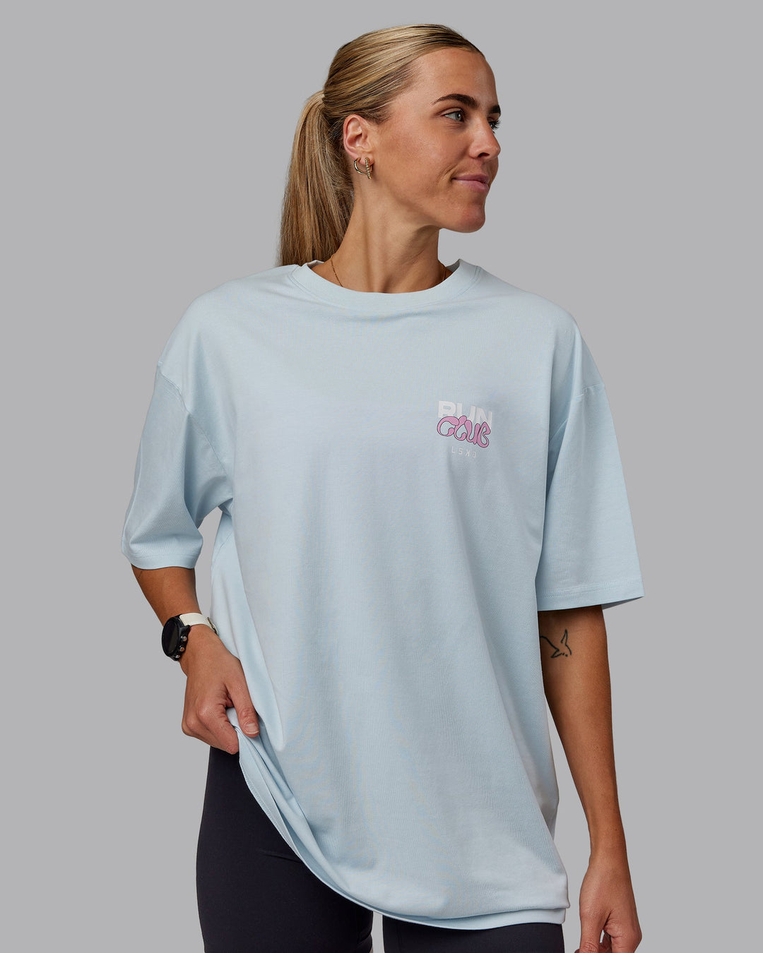 Woman wearing Unisex Gone Running FLXCotton Tee Oversize - Skyride-Bubblegum