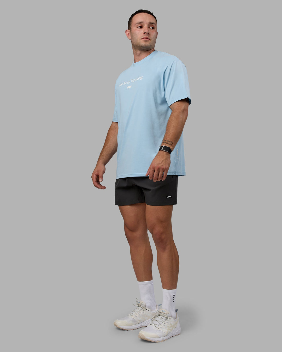 Man wearing Unisex Just Keep Running FLXCotton Tee Oversize - Glacial Blue-Off White