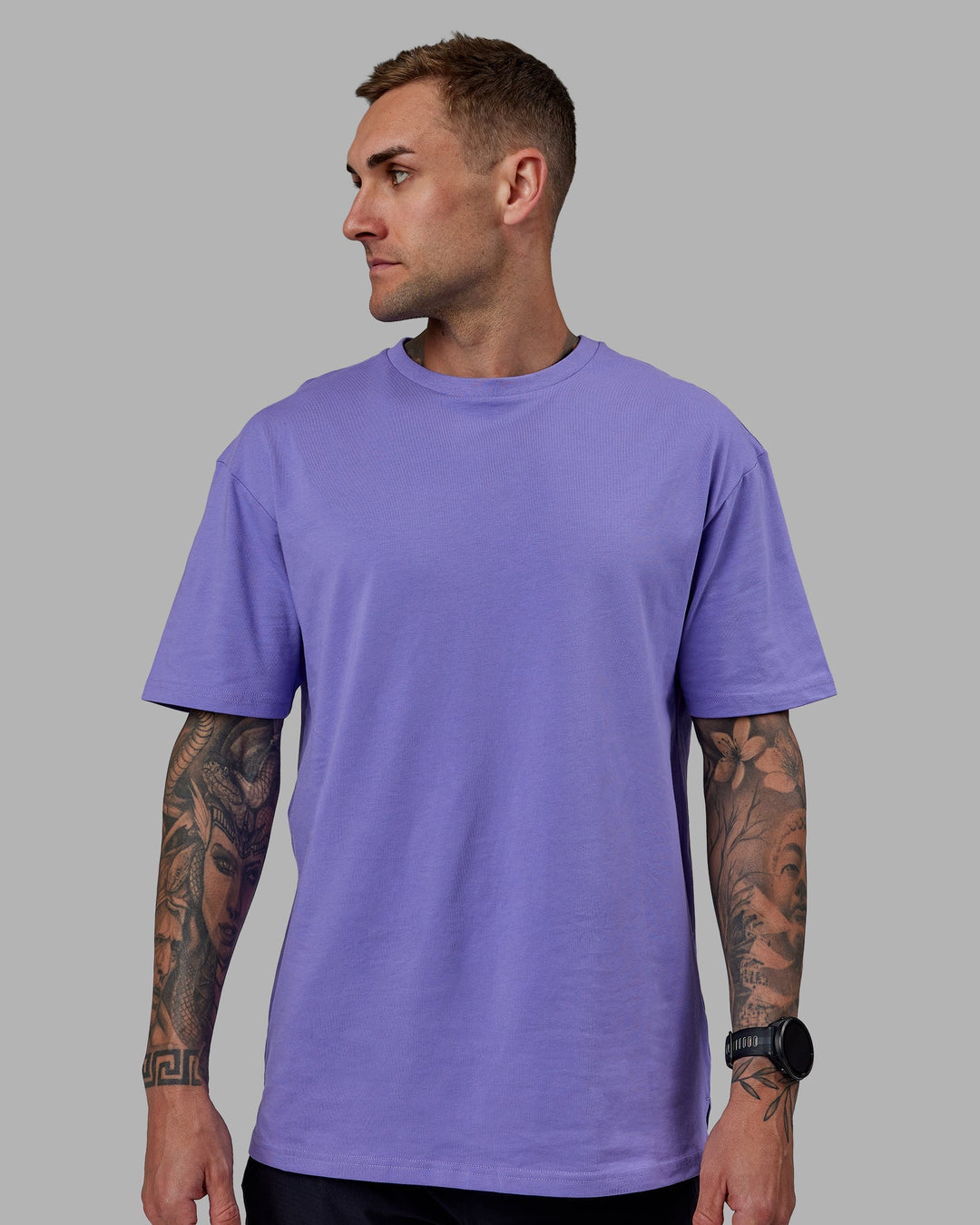 Man wearing Unisex Keep On Running FLXCotton Tee Oversize - Dahlia Purple