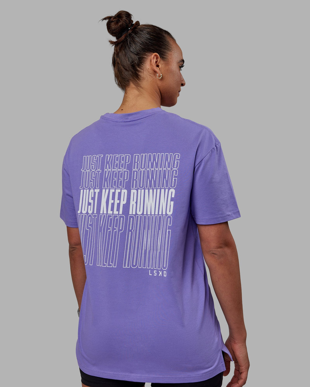 Woman wearing Unisex Keep On Running FLXCotton Tee Oversize - Dahlia Purple