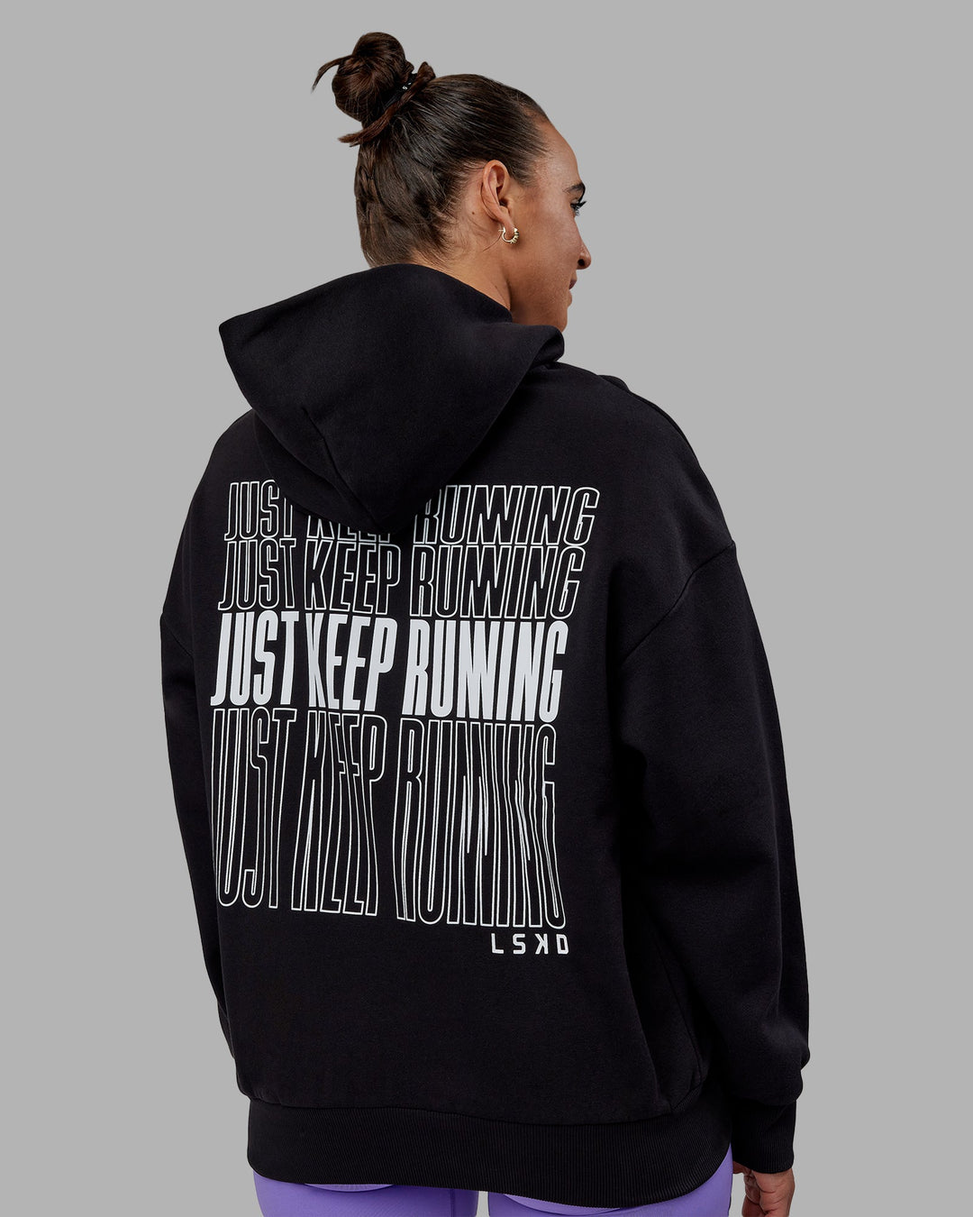 Woman wearing Unisex Keep on Running Hoodie Oversize - Black-White