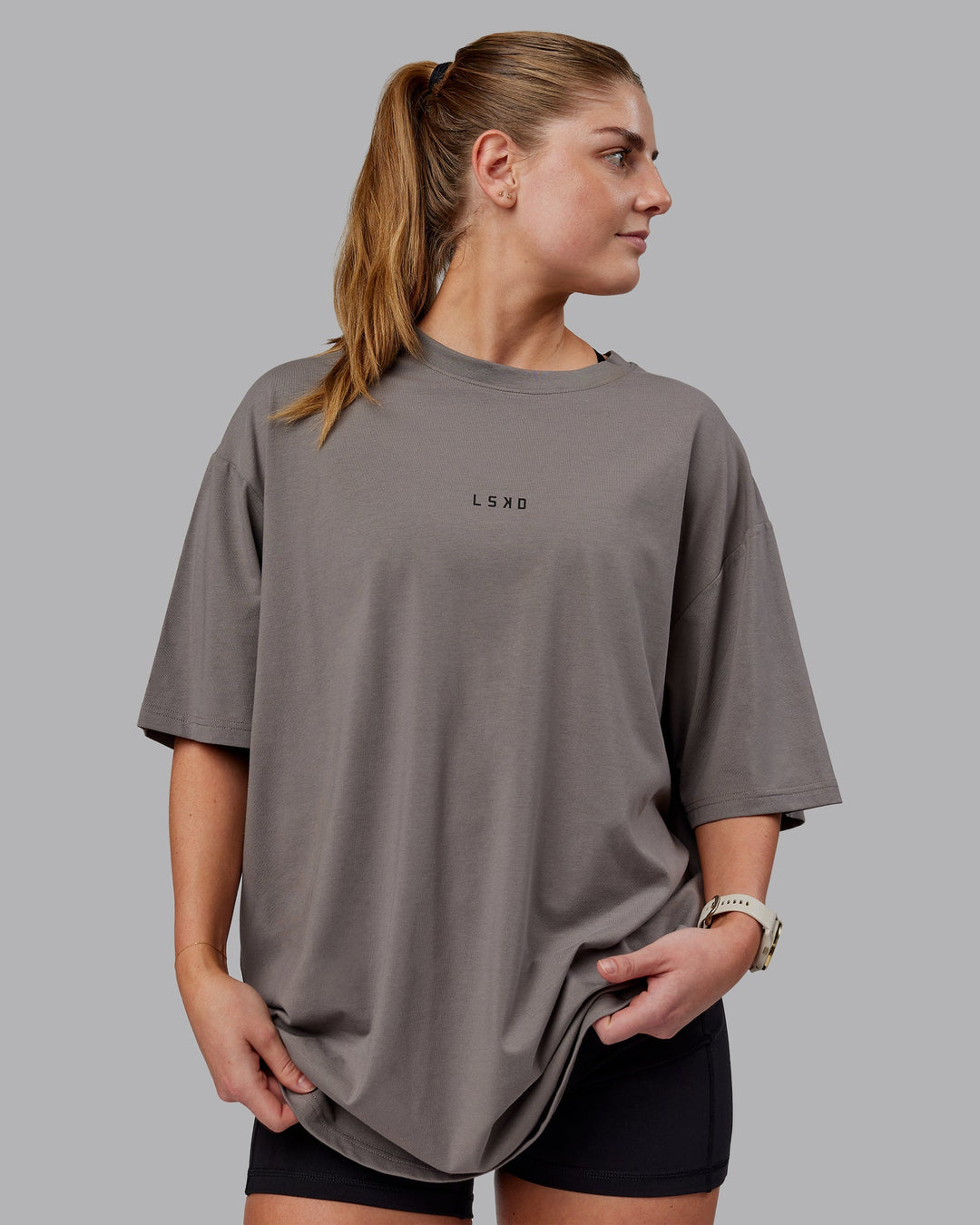 Woman wearing Unisex Leg It FLXCotton Tee Oversize - Storm Front-Black