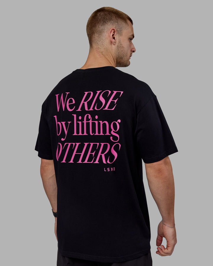 Man wearing Unisex Lift-Up FLXCotton Tee Oversize - Black-Fuschia Pink
