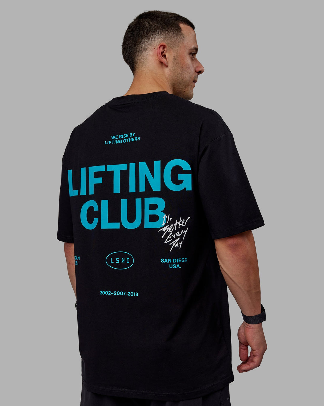 Man wearing Unisex Lifting Club FLXCotton Tee Oversize - Black-Blue Bird