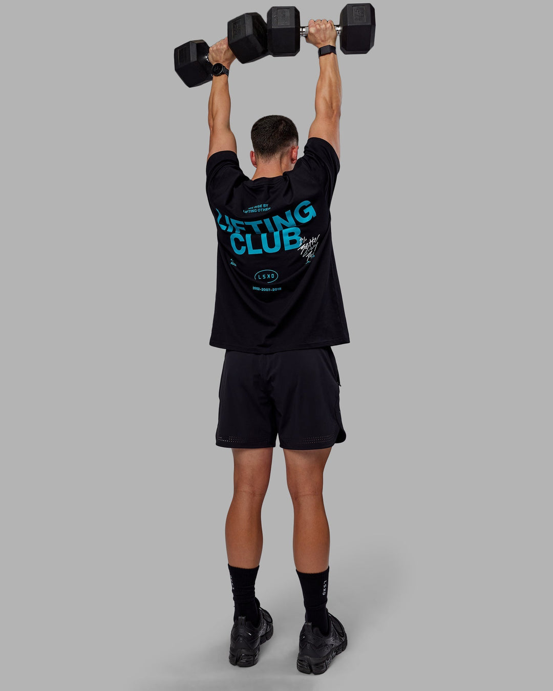 Man wearing Unisex Lifting Club FLXCotton Tee Oversize - Black-Blue Bird