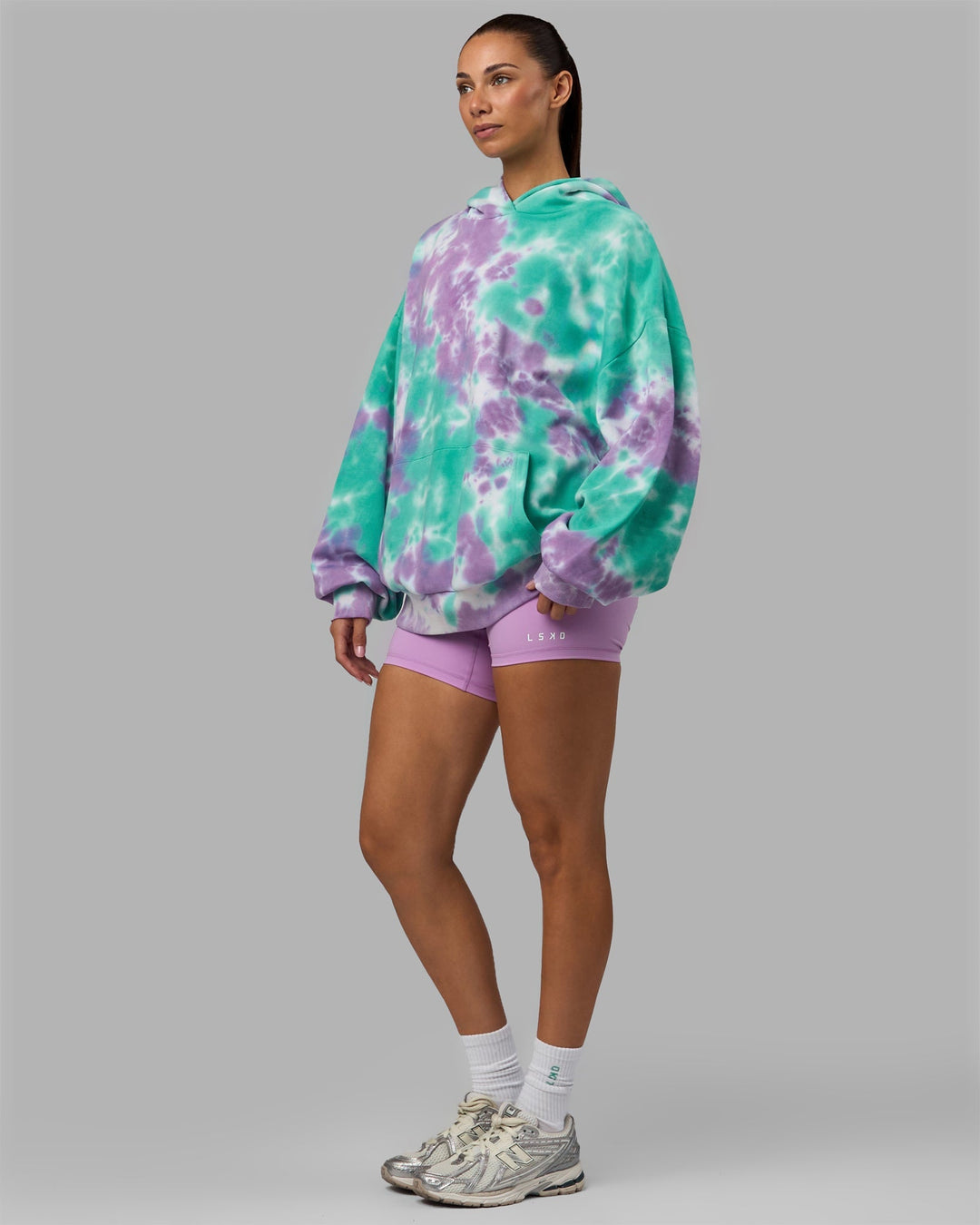 Woman wearing Unisex Lifting Club Hoodie Oversize - Cockatoo-Tie Dye