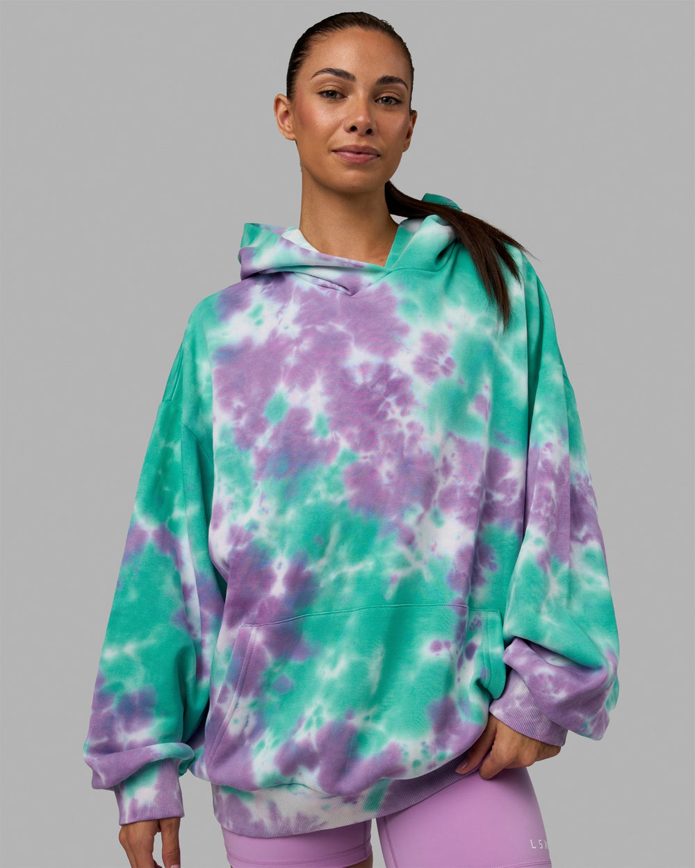 Woman wearing Unisex Lifting Club Hoodie Oversize - Cockatoo-Tie Dye