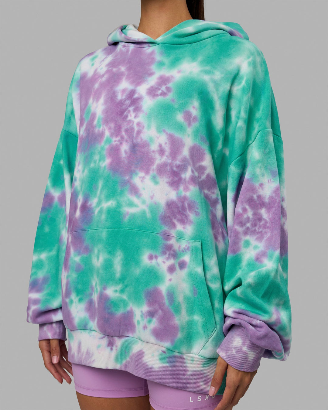 Woman wearing Unisex Lifting Club Hoodie Oversize - Cockatoo-Tie Dye