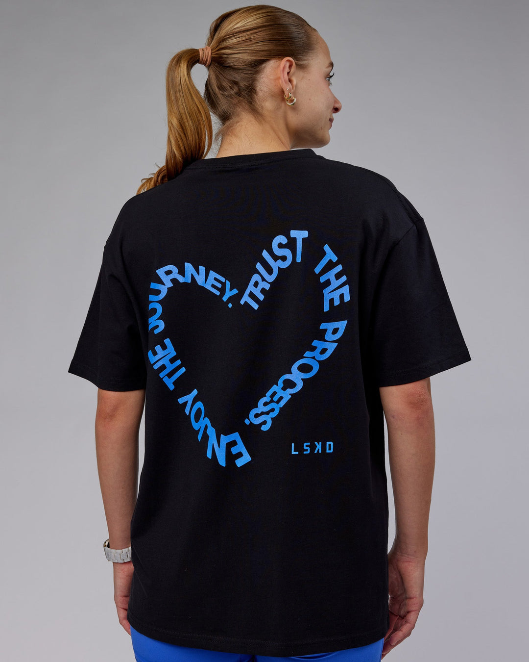 Woman wearing Unisex Love The Process FLXCotton Oversize Tee - Black-Power Cobalt