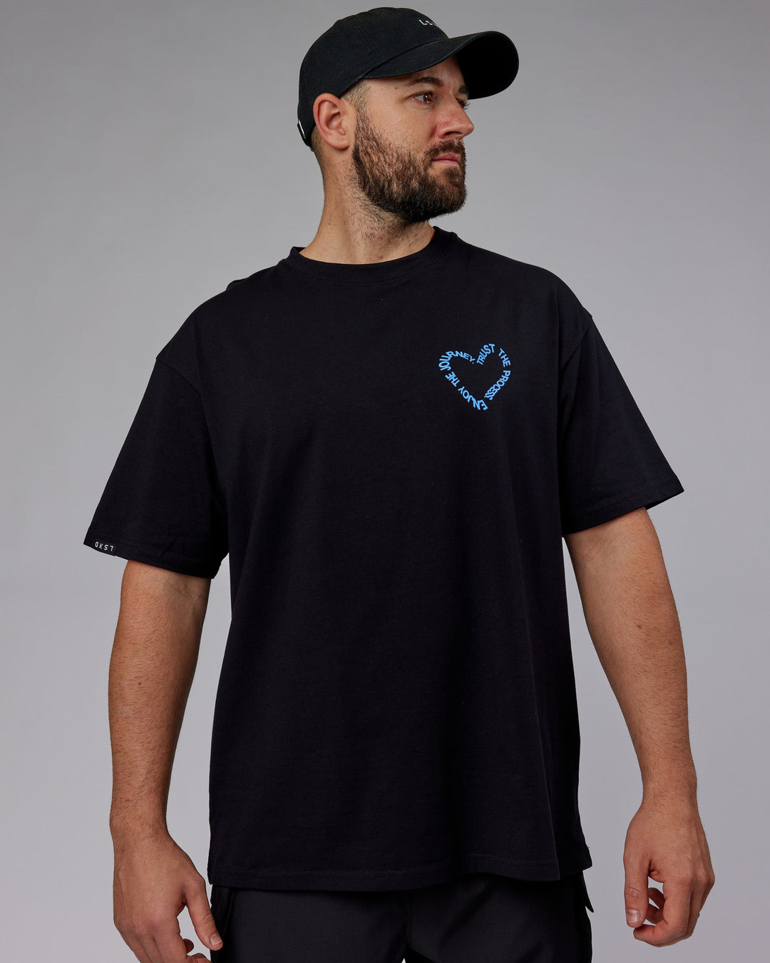 Man wearing Unisex Love The Process FLXCotton Oversize Tee - Black-Power Cobalt