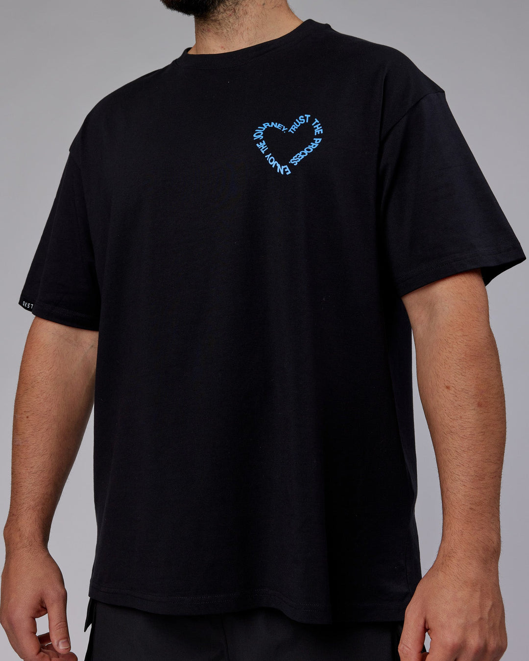 Man wearing Unisex Love The Process FLXCotton Oversize Tee - Black-Power Cobalt