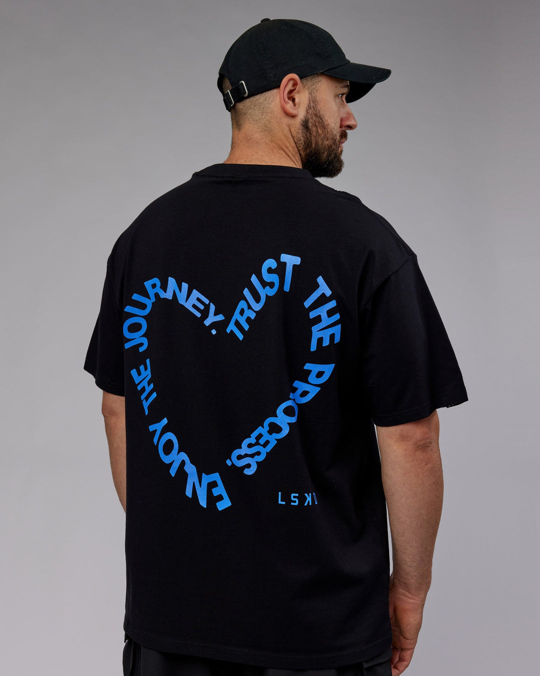 Man wearing Unisex Love The Process FLXCotton Oversize Tee - Black-Power Cobalt