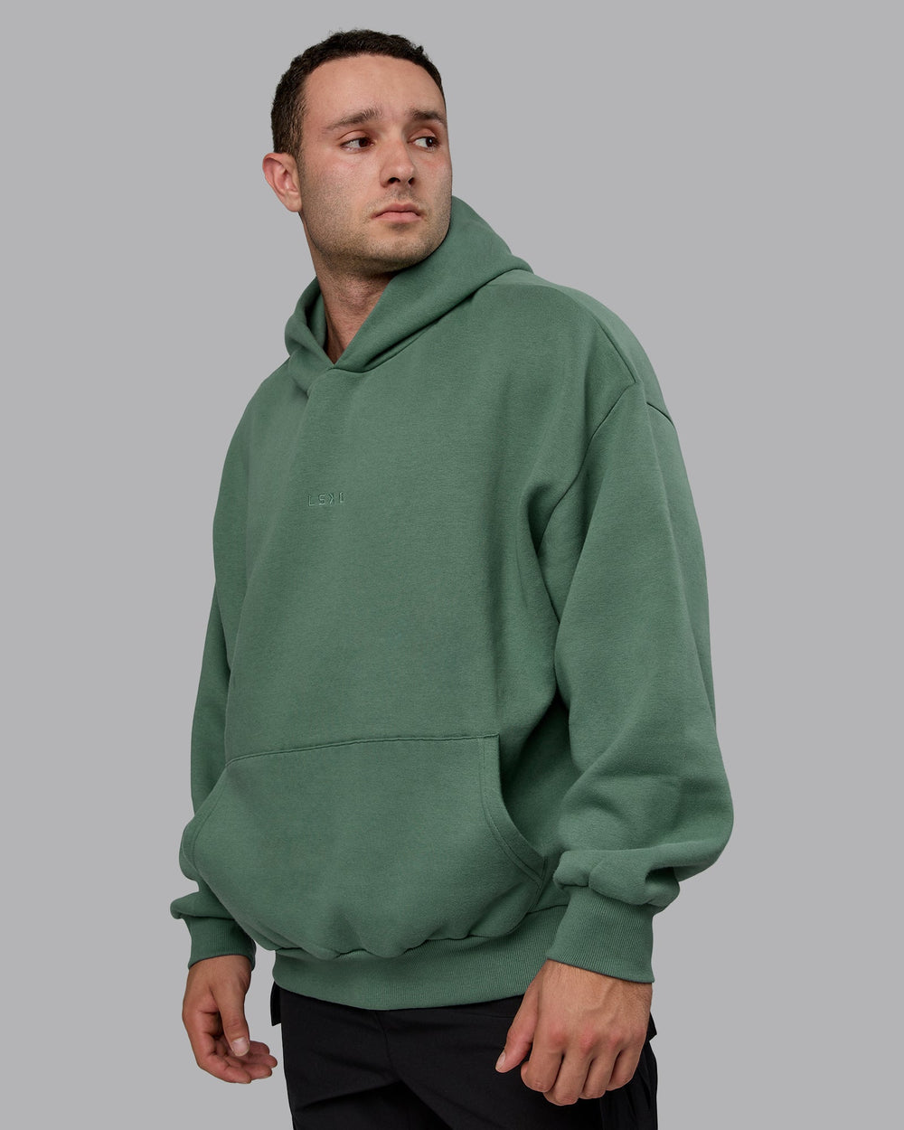 Man wearing Unisex MVP Hoodie Oversize - Sage Brush