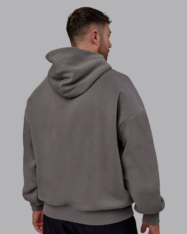 Man wearing Unisex MVP Hoodie Oversize - Storm Front
