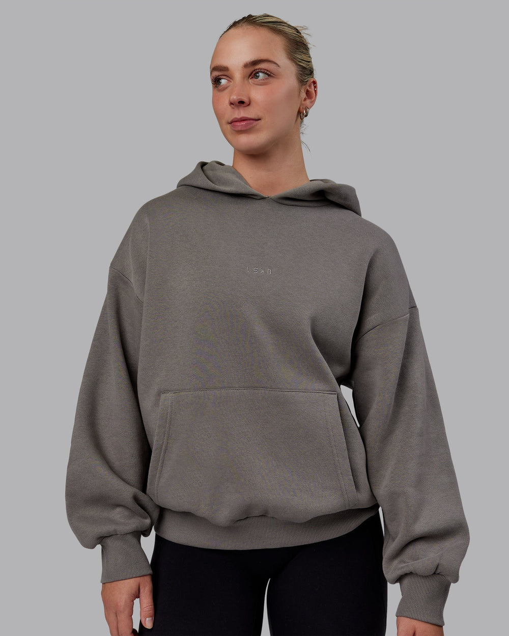 Woman wearing Unisex MVP Hoodie Oversize - Storm Front