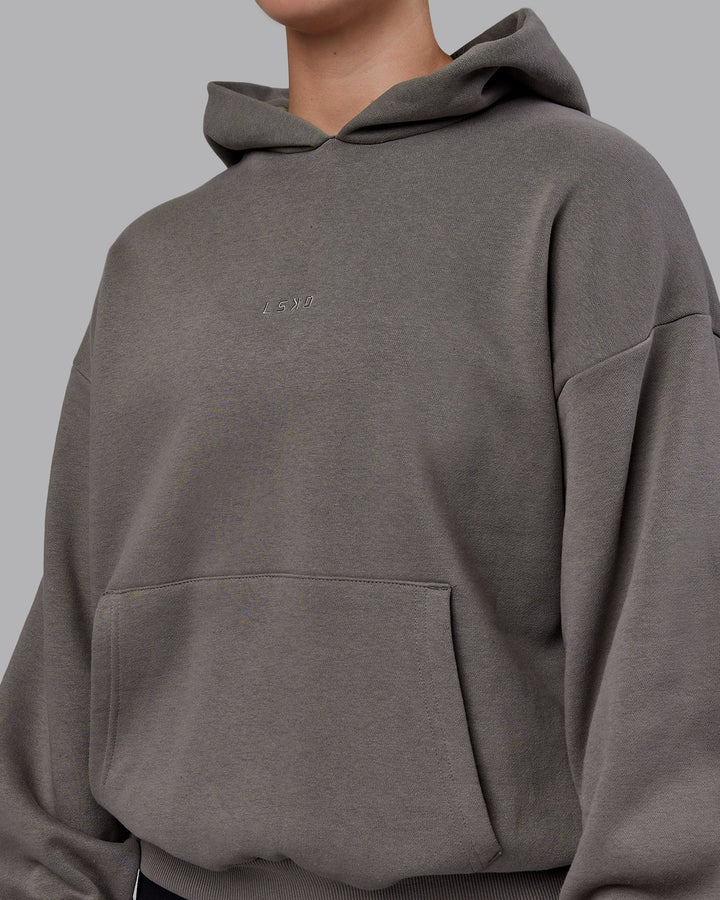 Woman wearing Unisex MVP Hoodie Oversize - Storm Front
