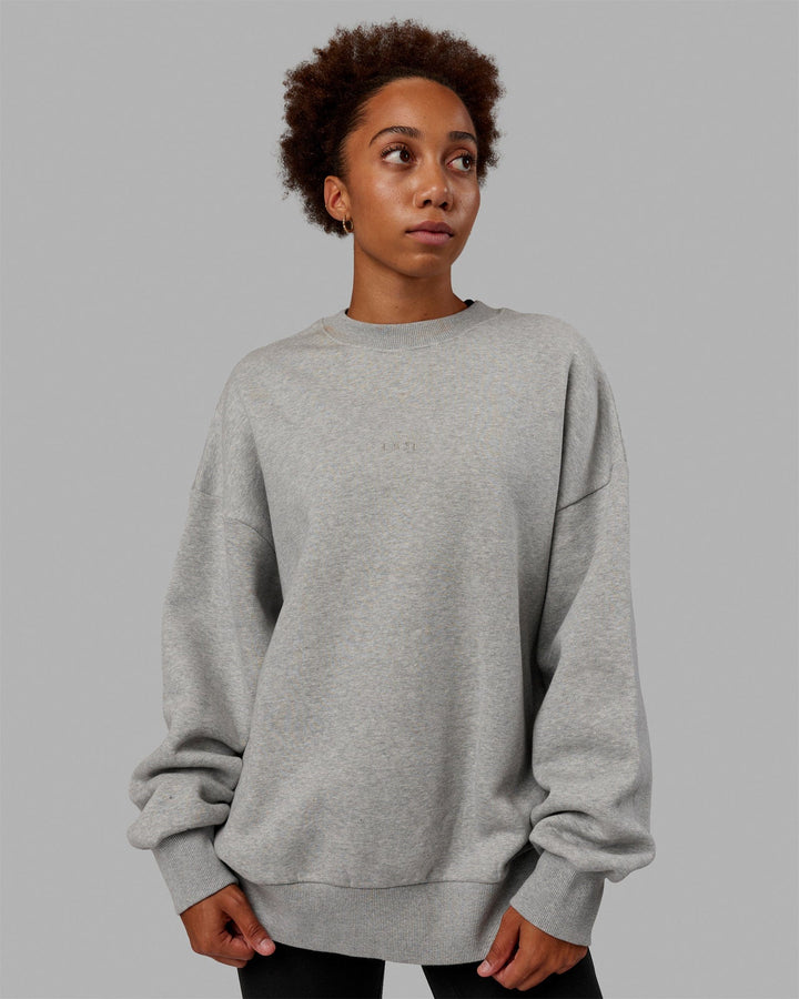Woman wearing Unisex MVP Sweater Oversize - Light Grey Marl