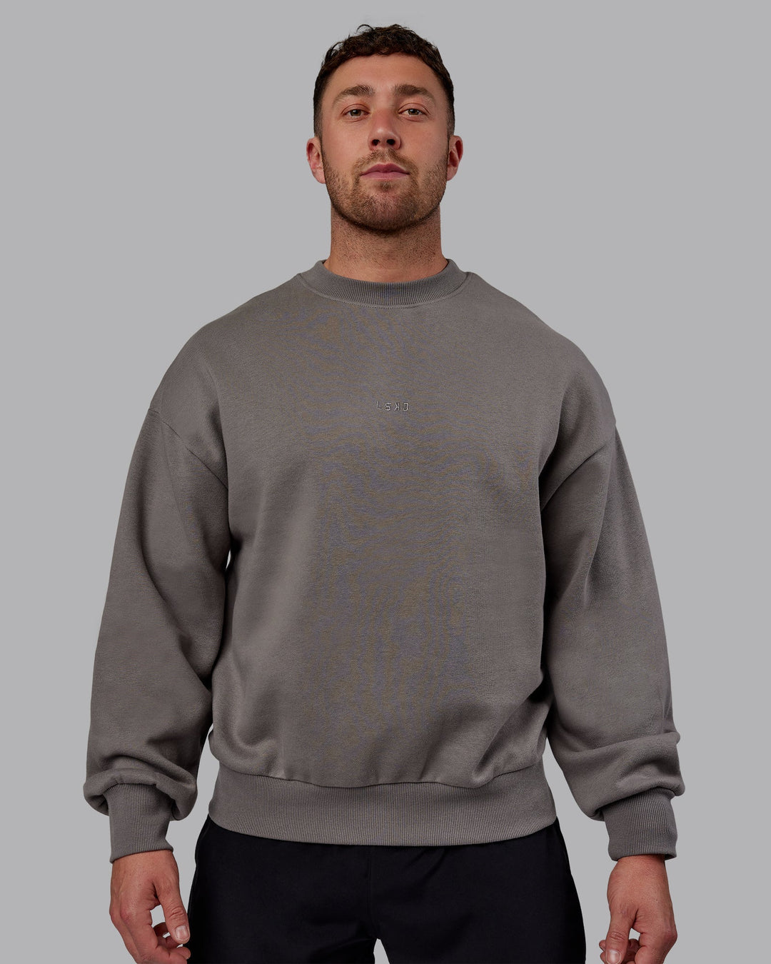 Man wearing Unisex MVP Sweater Oversize - Storm Front