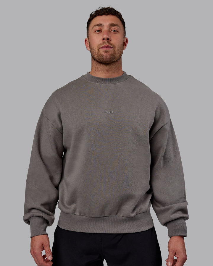 Man wearing Unisex MVP Sweater Oversize - Storm Front
