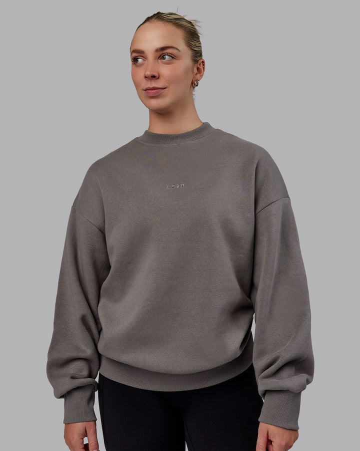 Woman wearing Unisex MVP Sweater Oversize - Storm Front
