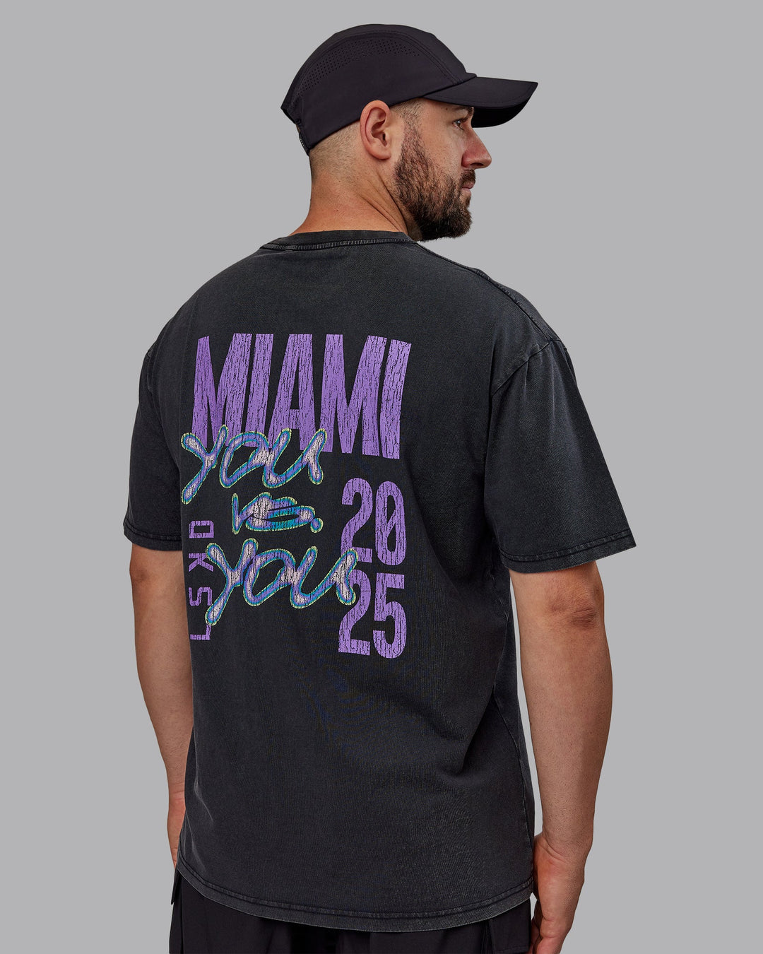 Man wearing Unisex Miami25 Washed FLXCotton Tee Oversize - Black-Amethyst