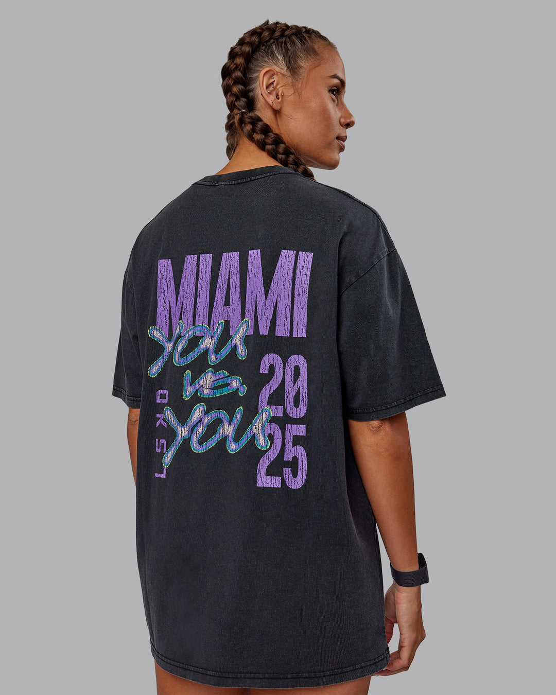 Woman wearing Unisex Miami25 Washed FLXCotton Tee Oversize - Black-Amethyst