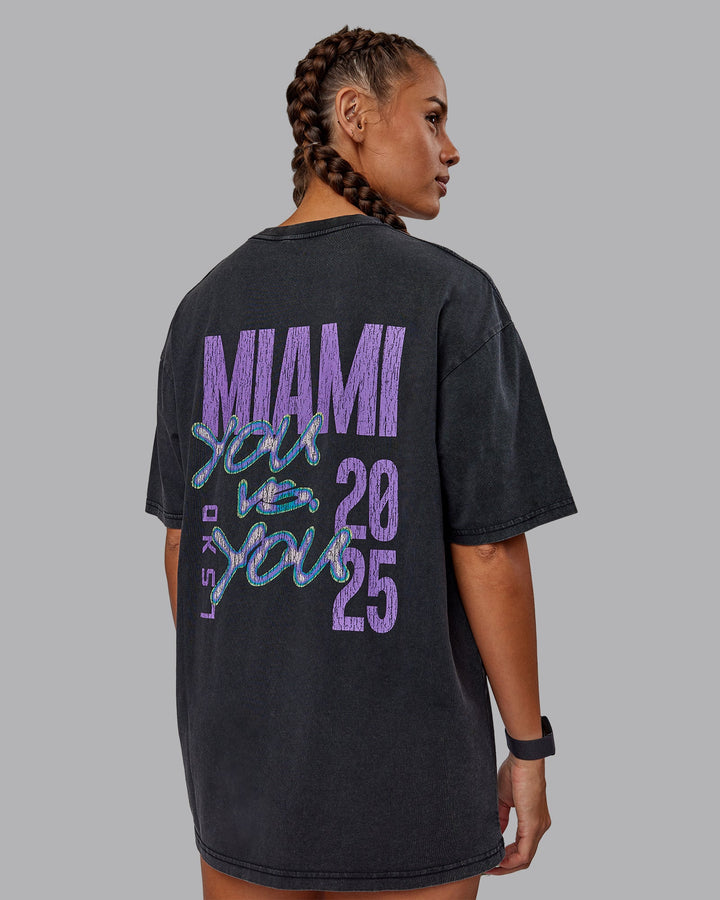 Woman wearing Unisex Miami25 Washed FLXCotton Tee Oversize - Black-Amethyst
