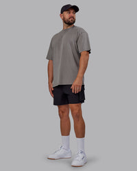 Man wearing Unisex Miami25 Washed FLXCotton Tee Oversize - Storm Front-Lemon Fizz