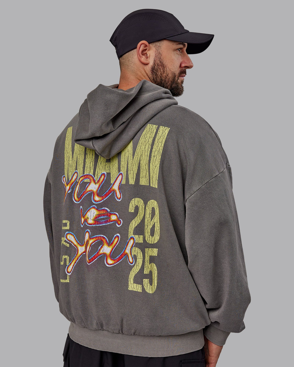 Man wearing Unisex Miami25 Washed Hoodie Oversize - Storm Front