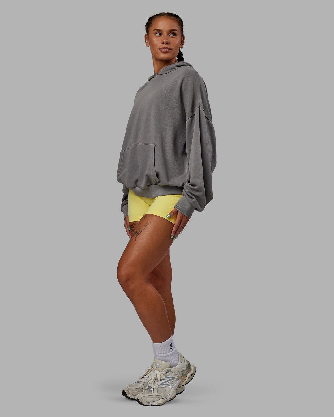 Woman wearing Unisex Miami25 Washed Hoodie Oversize - Storm Front