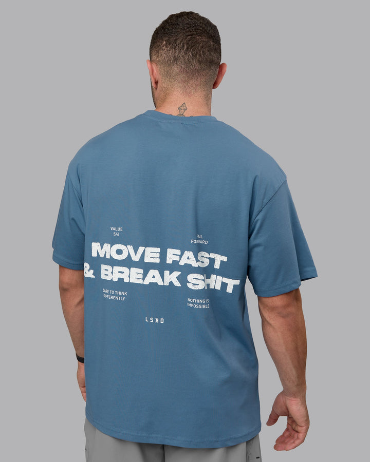 Man wearing Unisex Move Fast Value Series FLXCotton Tee Oversize - Elemental Blue-Off White
