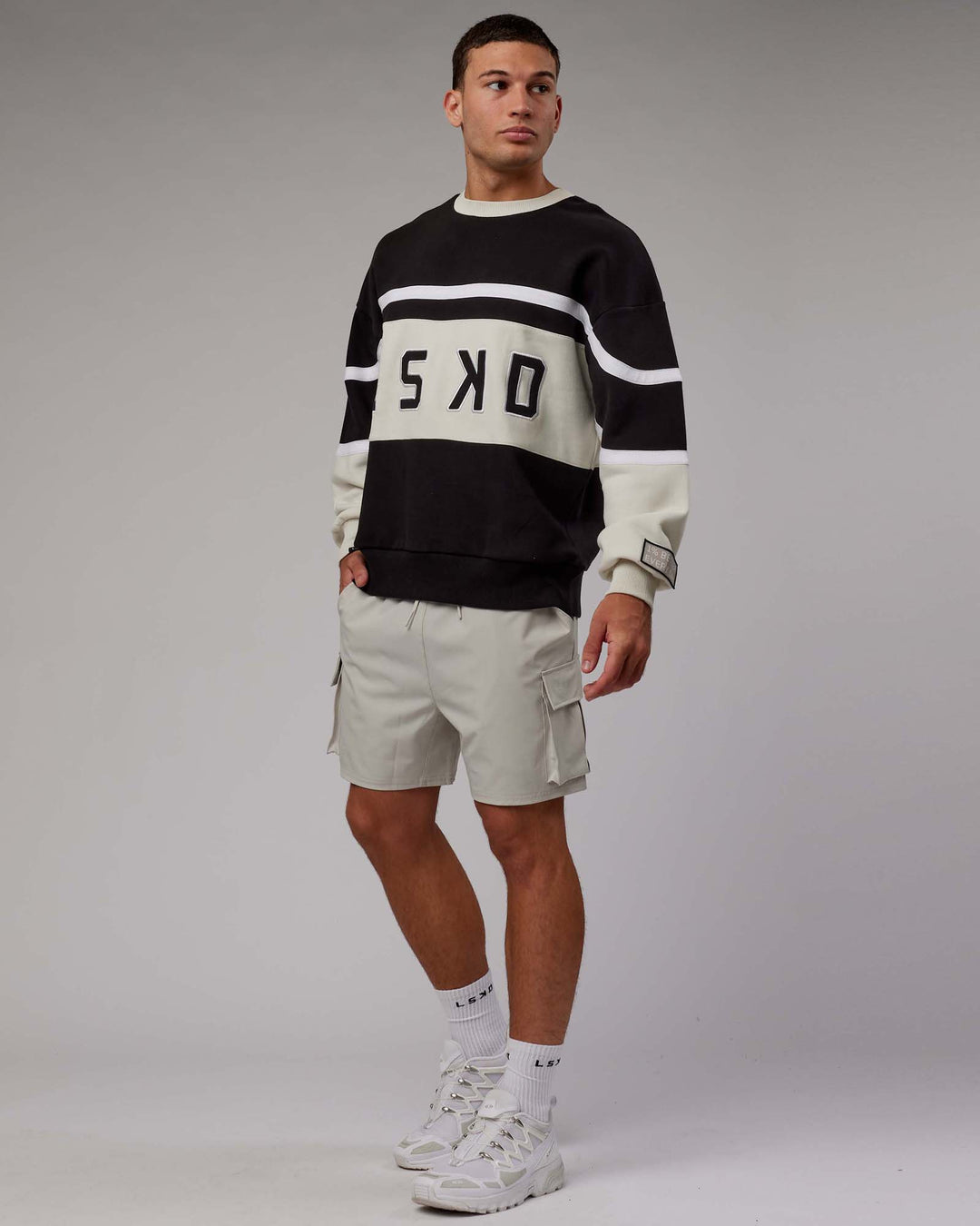 Man wearing Unisex PrimeTime Sweater Oversize - Black-Bone