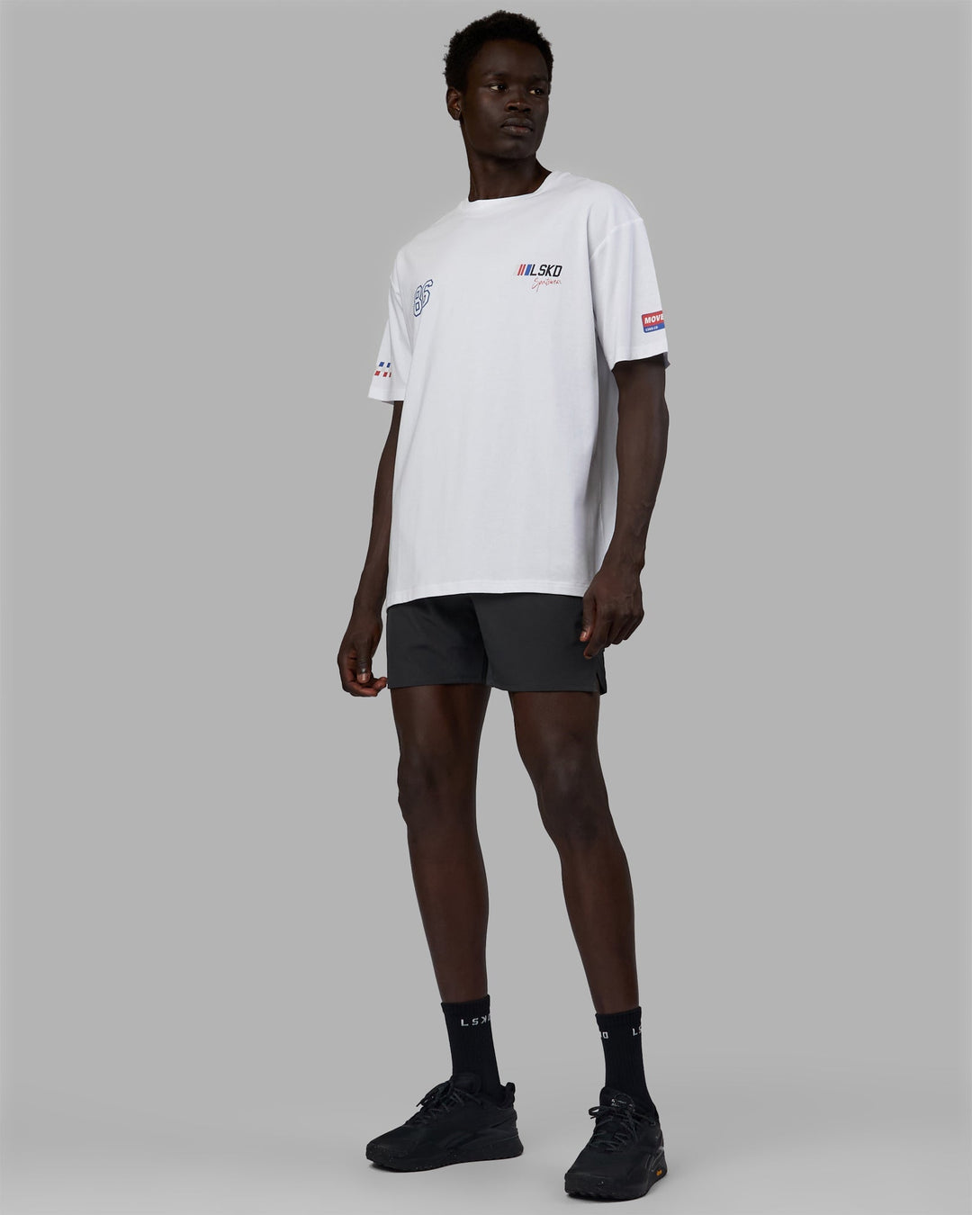 Man wearing Unisex Redline FLXCotton Tee Oversize - White-Navy
