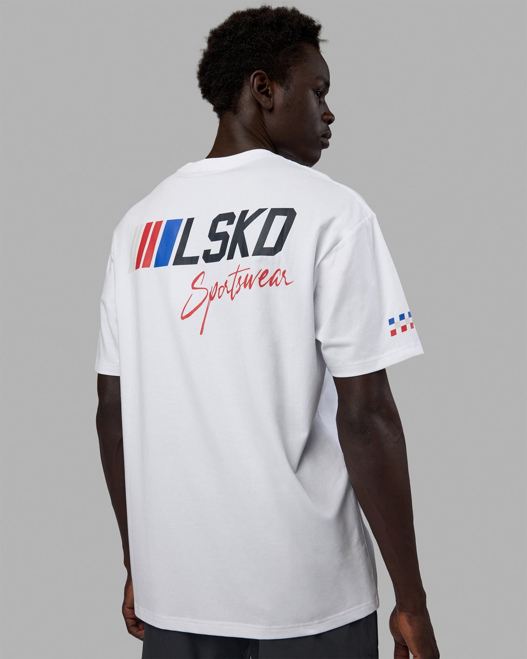 Man wearing Unisex Redline FLXCotton Tee Oversize - White-Navy