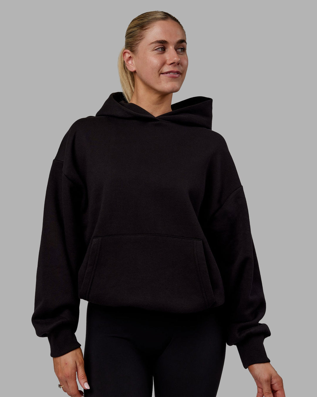 Woman wearing Sara Unisex Hoodie Oversize - Black-Black